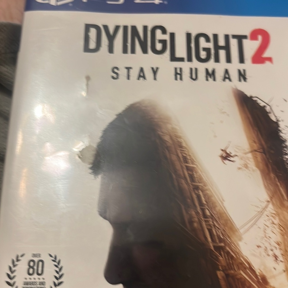 Dyling light 2 stay human white and blue ps4 symbol at top